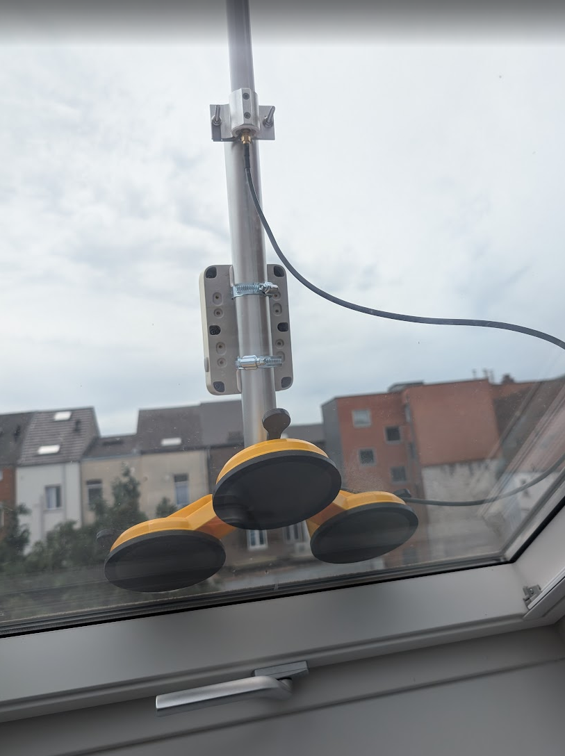 The Meshtastic node mounted on the Velux window, on a very gloomy day